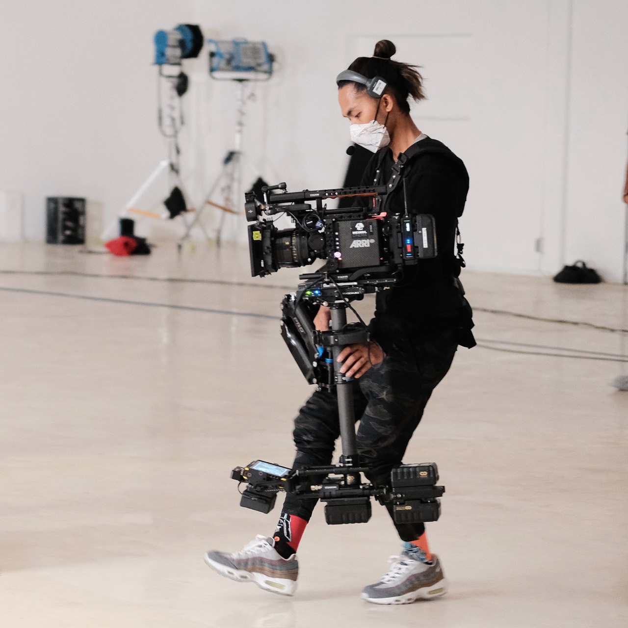 Alvin Octoman balancing a Steadicam rig in a studio